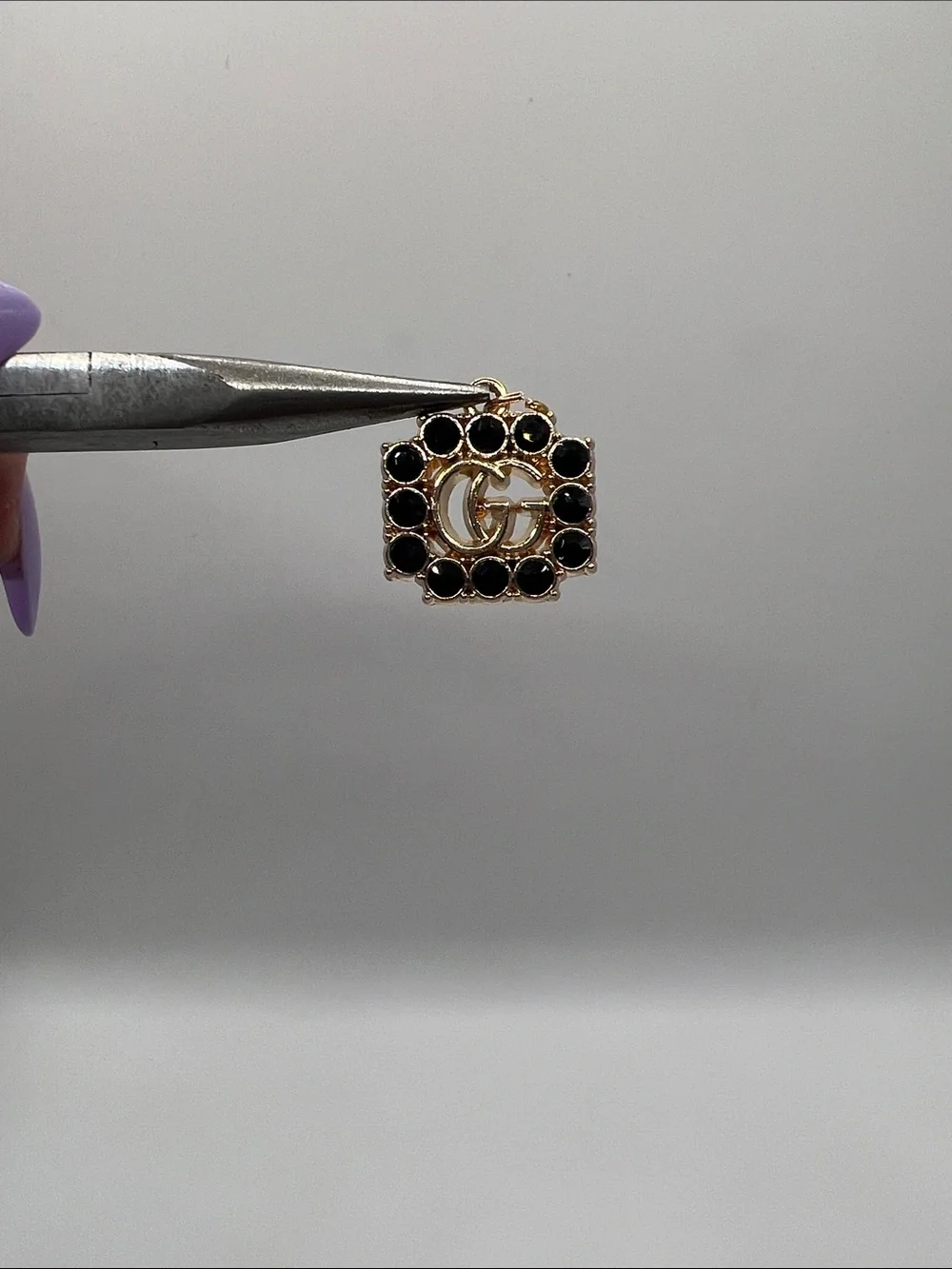 1430. Gold and Black Crystal Logo Charm Pendant